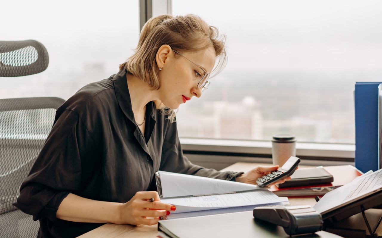 A business woman checking financial statements