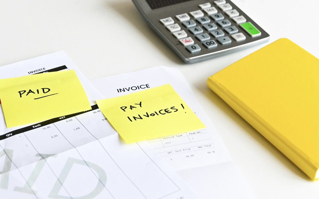 Reminders for invoices and taxes on documents on a table